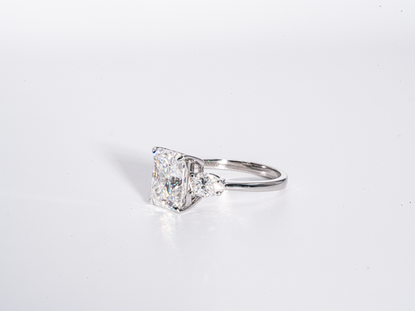 4 Carat Radiant Cut with Pear Shaped Side-Stone Moissanite Engagement Ring