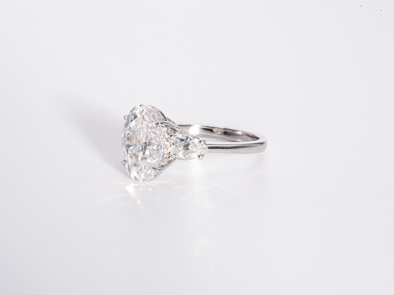 4 Carat Oval Cut with Pear Shaped Side-Stone Moissanite Engagement Ring