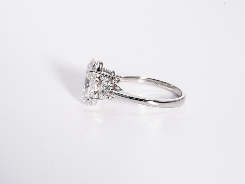 4 Carat Oval Cut with Pear Shaped Side-Stone Moissanite Engagement Ring