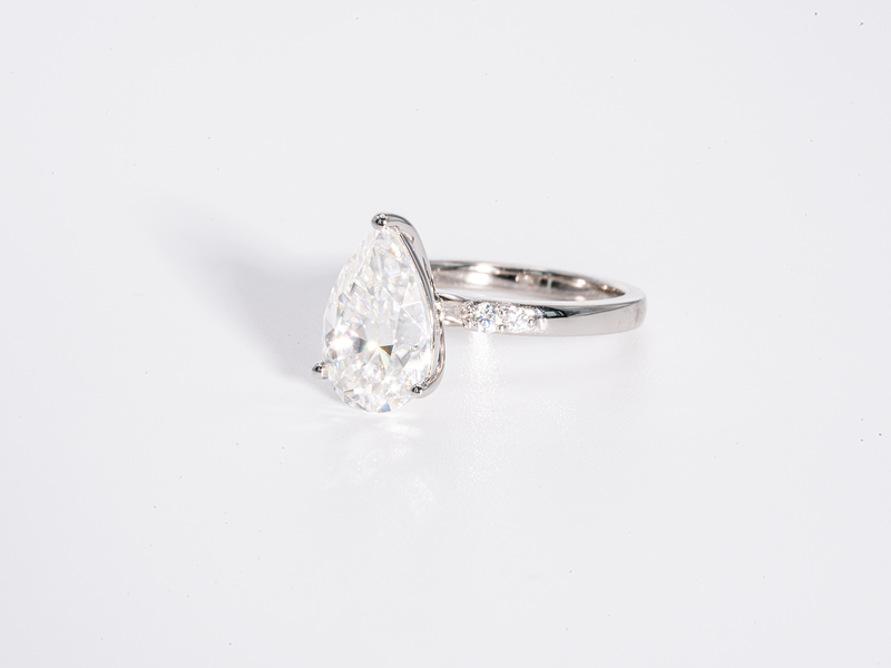 3 Carat Pear Shaped Solitaire with Side Stone Moissanite Engagement Ring