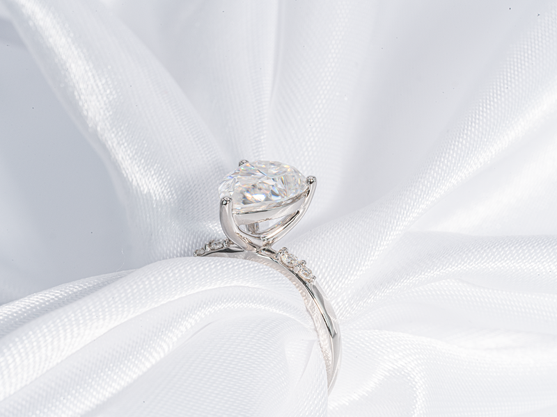 3 Carat Pear Shaped Solitaire with Side Stone Moissanite Engagement Ring