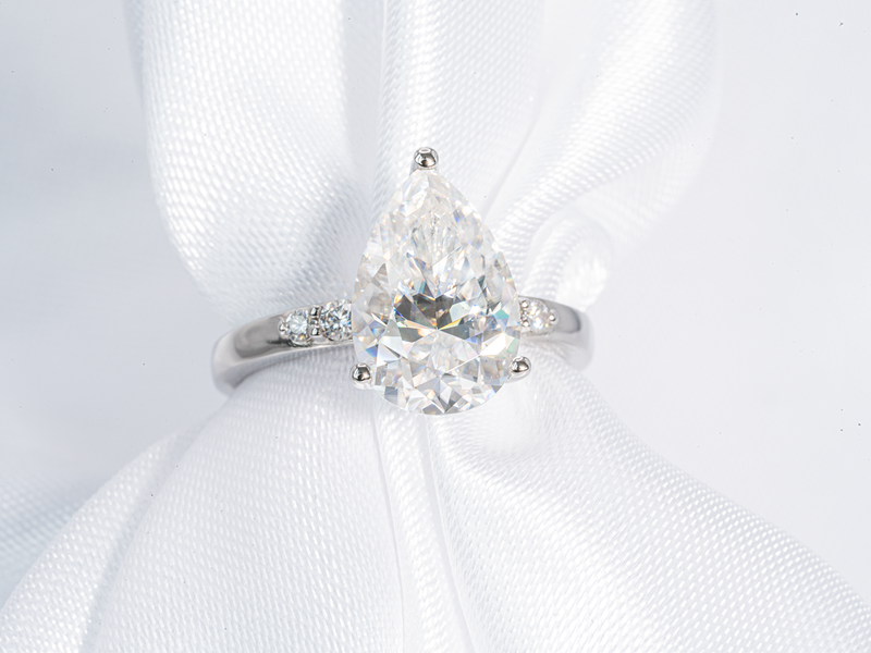 3 Carat Pear Shaped Solitaire with Side Stone Moissanite Engagement Ring